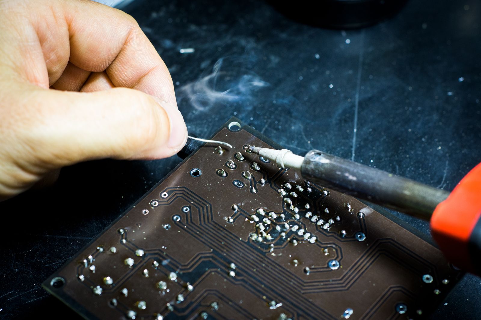 Hand-soldering a circuit board