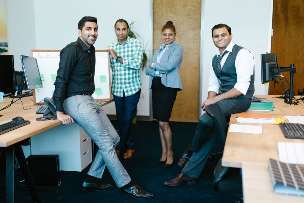 MRO‑TEK leadership team members together in the office