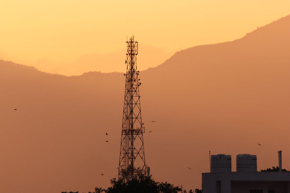 A telecom tower at sunset