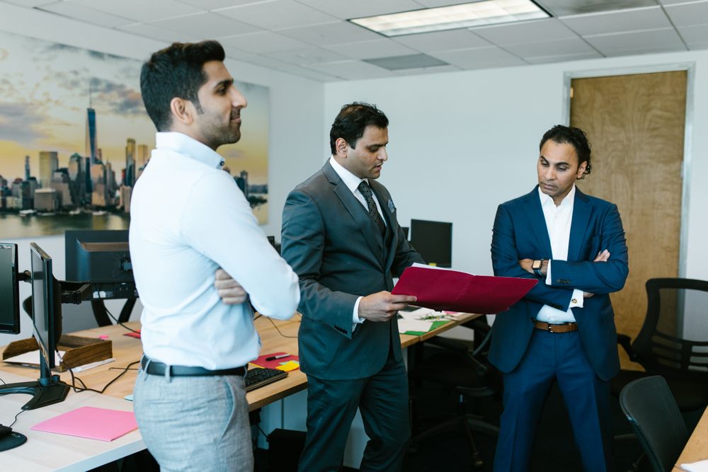 MRO‑TEK project delivery team reviewing a deployment plan