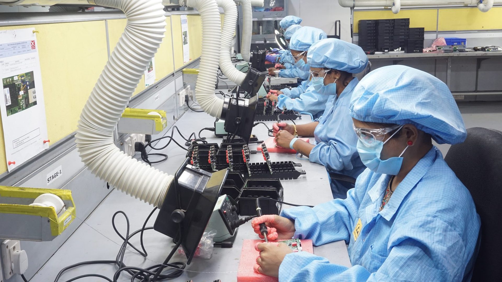 MRO‑TEK manufacturing engineer performing PCB assembly