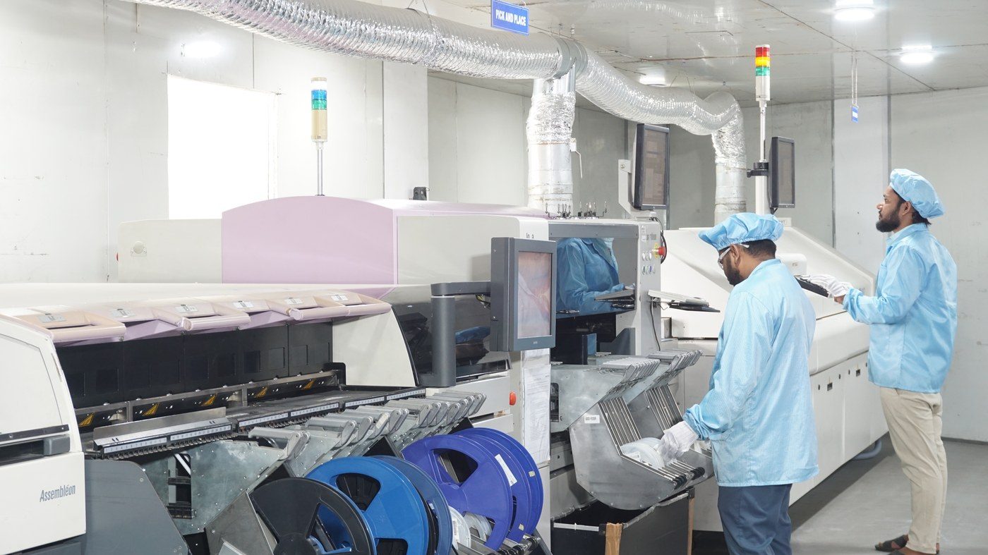 Component reels staged at the pick-and-place station