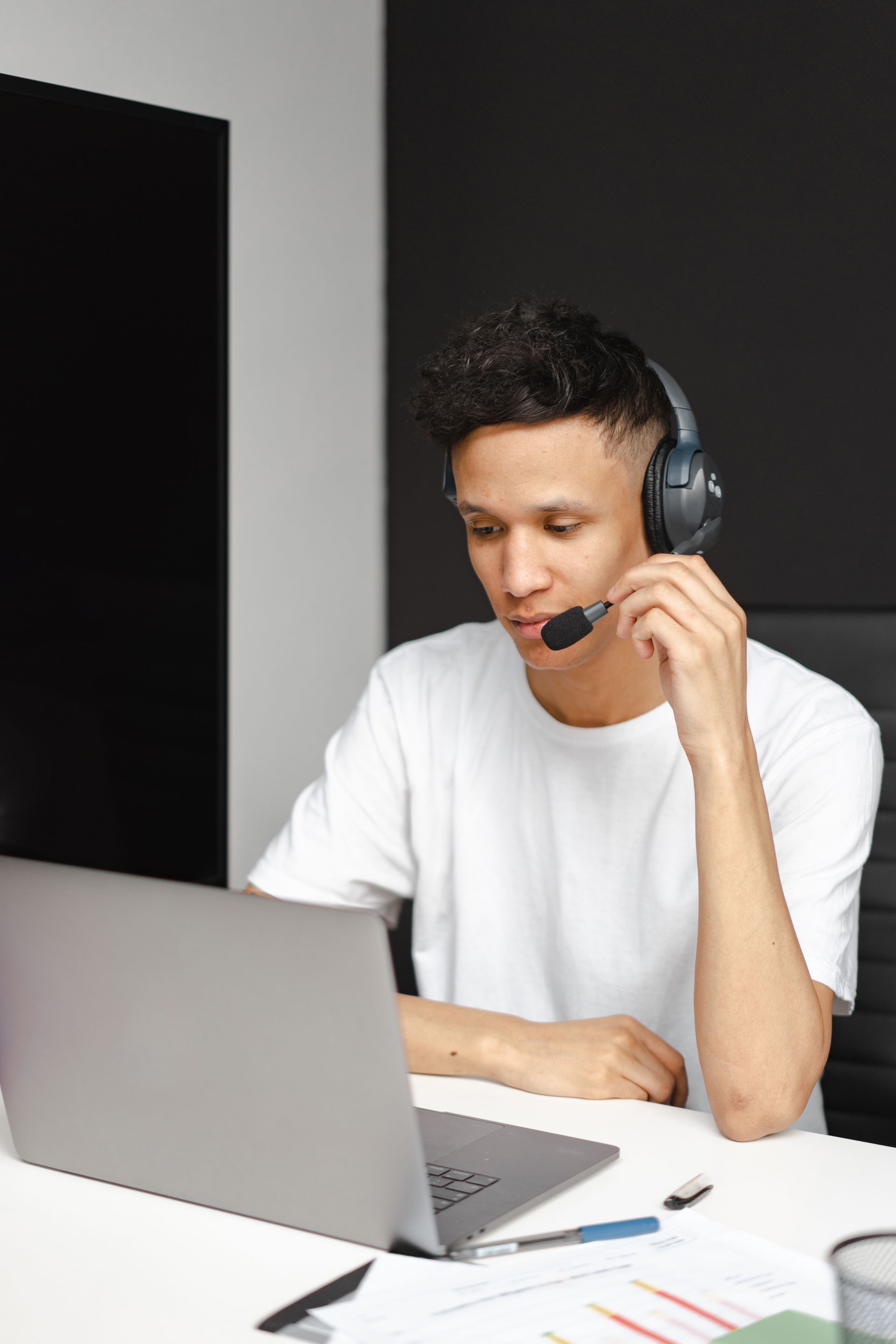 Support engineer on a headset call, handling an escalation